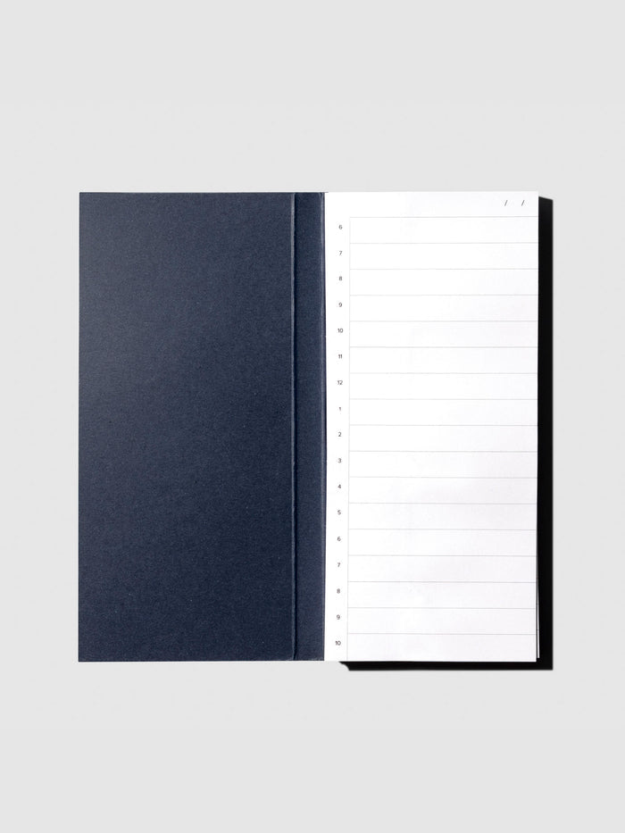 Sticky note displayed with packaging open on a neutral background.