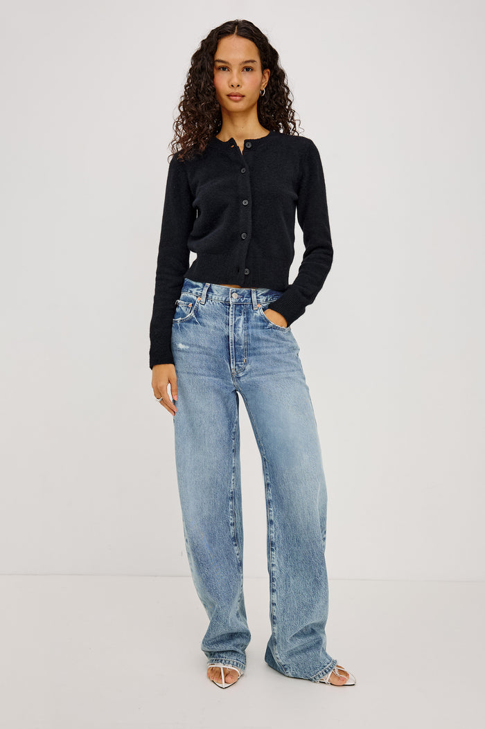 Matilda Cardigan in Wool-Blend Knit WIth Relaxed Slightly Cropped Fit, Crew Neck, Front Buttons, and Ribbed Trim in Black Colorway - Full Body Front View Featured on Model