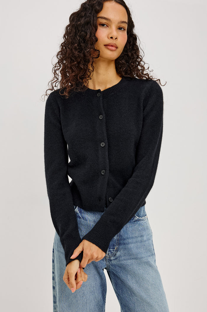 Matilda Cardigan in Wool-Blend Knit WIth Relaxed Slightly Cropped Fit, Crew Neck, Front Buttons, and Ribbed Trim in Black Colorway - Upper Body Front View Featured on Model