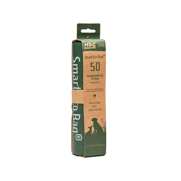 White background with MDC Smart Eco bags in green and brown cardboard packaging. On the packaging is text 'Biodegradable Poo Bags, 50 bags per roll'.