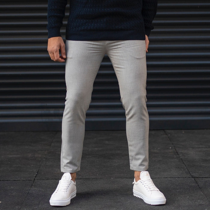 Martin Valen men's gray trousers, front view on model, light-gray slim fit cropped at the ankle
