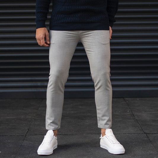 Martin Valen men's gray trousers, front view on model, light-gray slim fit cropped at the ankle