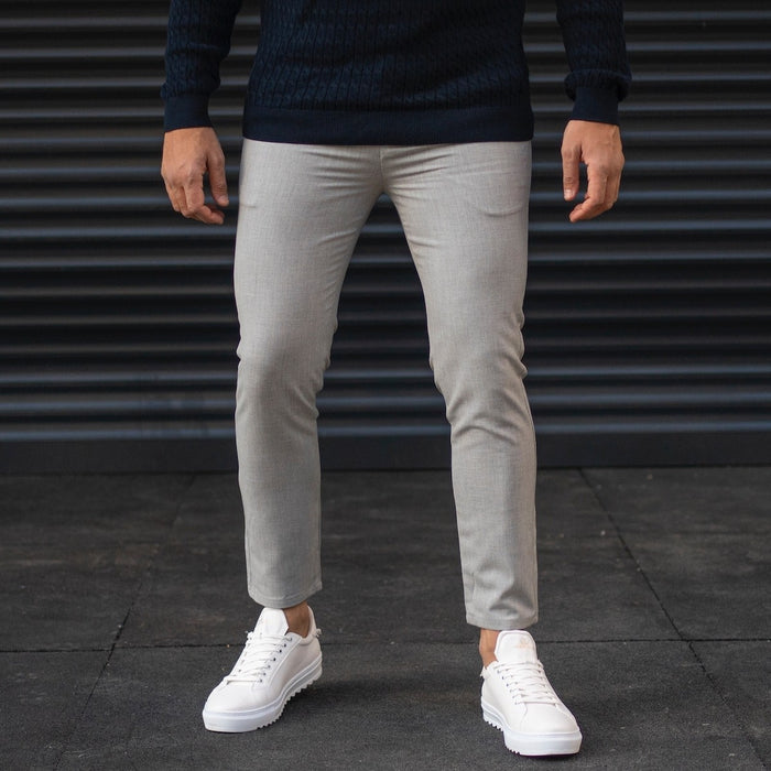 Martin Valen men's gray trousers, mid-front view on model, light-gray with fitted waist and tapered legs