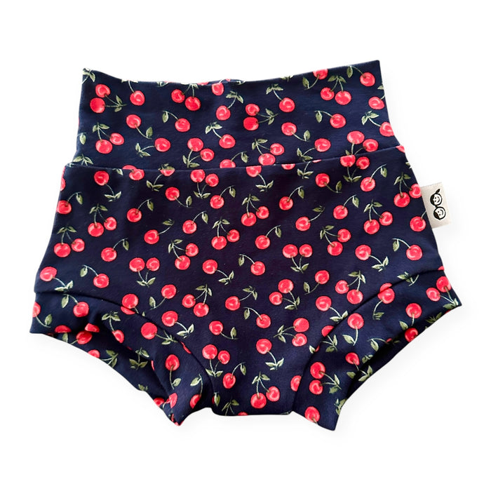 Midnight Cherries baby bummies – navy blue baby shorts with a cherry pattern. Handmade baby girl bloomers, perfect diaper covers for summer.