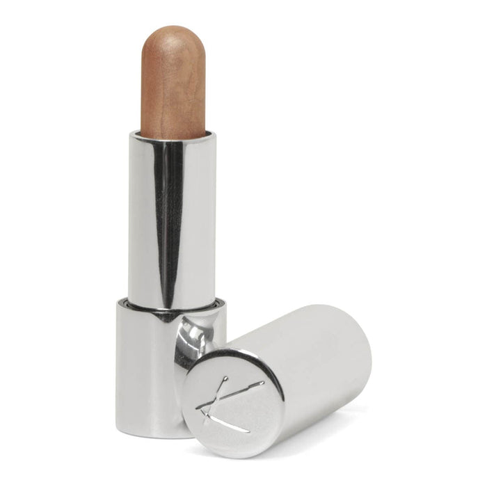 Silver tube of cream bronzer in a medium shade.