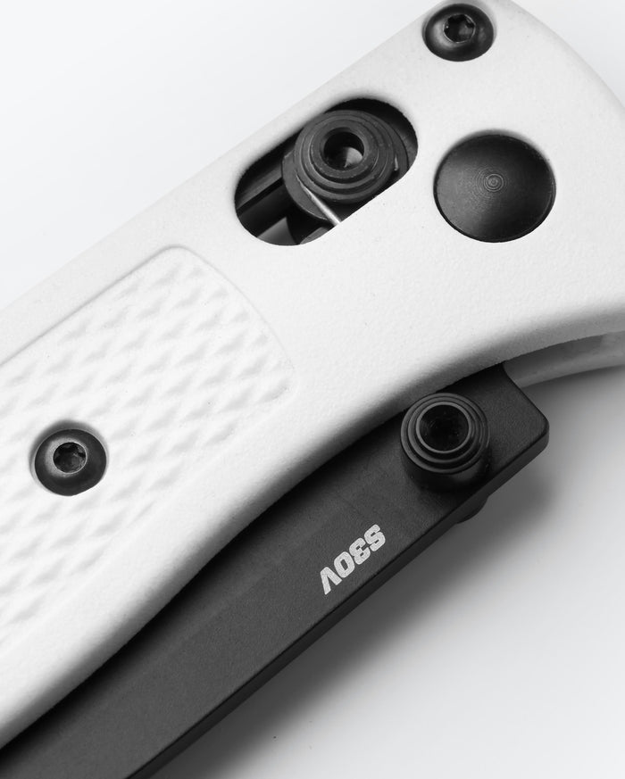 Mini Bugout® White Grivory® - AXIS Lock Mechanism Close-up Detail | Benchmade Knife Co.