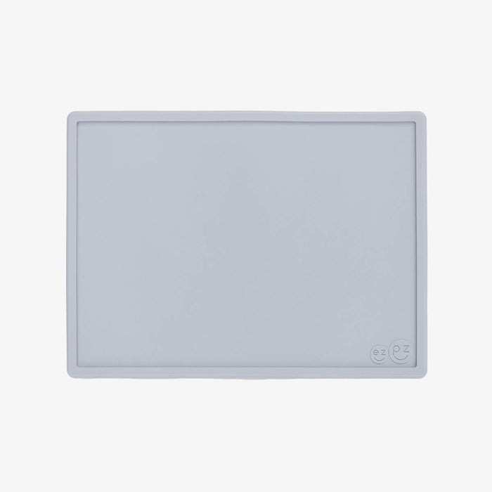 ezpz Mini Placemat in Pewter Gray is a silicone placemat for toddlers that grips to the table #color_pewter