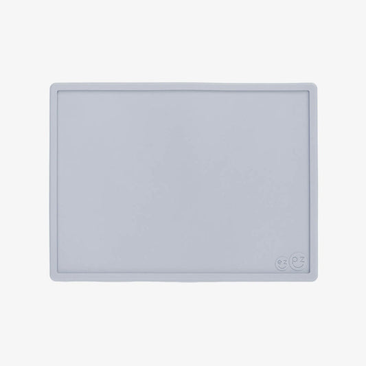 ezpz Mini Placemat in Pewter Gray is a silicone placemat for toddlers that grips to the table #color_pewter