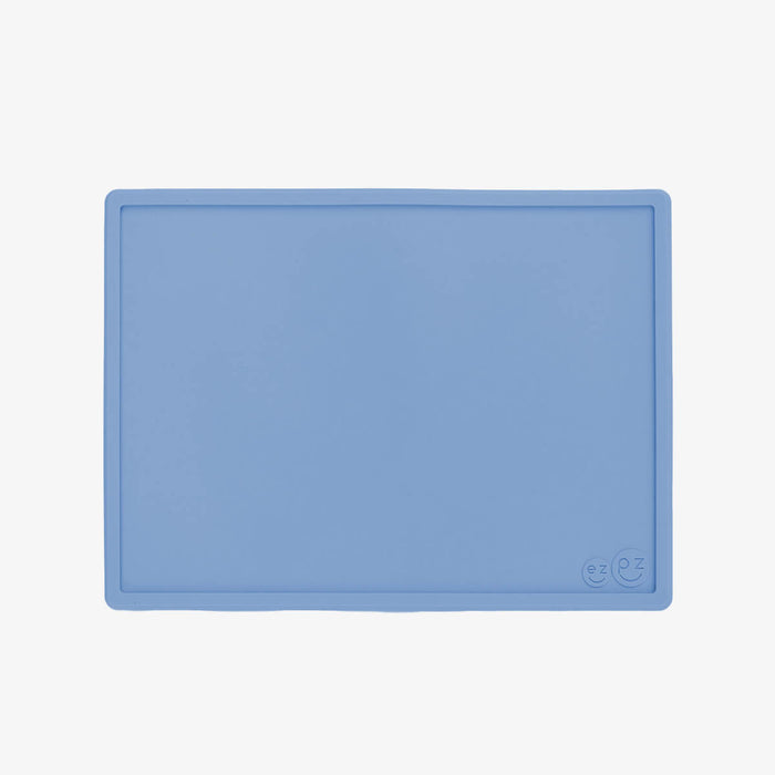 ezpz Mini Placemat in Indigo Blue is a silicone placemat for toddlers that grips to the table #color_indigo