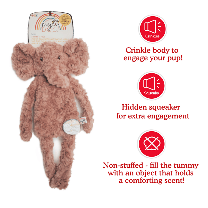 Dusky pink elephant shaped dog toy with long arms and legs, stitched detail eyes, with tags attached to top and mid-section. Red text along side picture of Elephant says 'Crinkle body to engage your pup!', 'Hidden squeaker for extra engagement', 'Not-stuffed - fill the tummy with an object that holds a comforting scent!' Pictured on a white background.