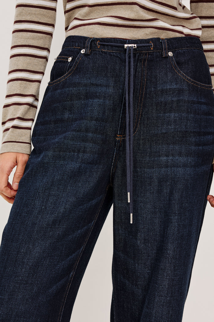 Normandie Pant in Cotton-Lyocell Blend With Relaxed Wide Legs, Drawstring Waistband, Zip Fly, and 5-Pockets in Rinse Wash Colorway - Mid Body Front View Featured on Model