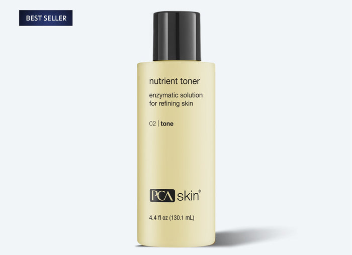 Bottle of Nutrient Toner | PCA Skin, an enzymatic solution for refining skin tone, shown on a light background with a black cap and beige label.