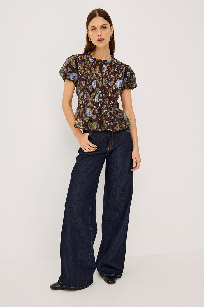 Pepper Shirt in Cotton Poplin With Loose Boxy Fit, Pintuck Detailing, Puff Cap Sleeves, Center-Front Buttons, and Soft Peplum Hem in Willow Colorway - Full Body Front View Featured on Model