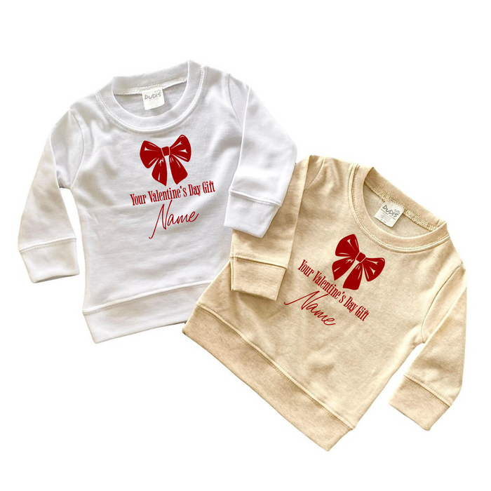 Personalized Valentine's Day baby sweatshirt with red bow design - Custom name gift for baby's first Valentine's Day. Perfect keepsake!