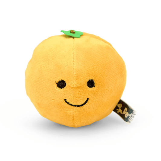 Orange fruit plush toy with green leaf detail and a smiley face.