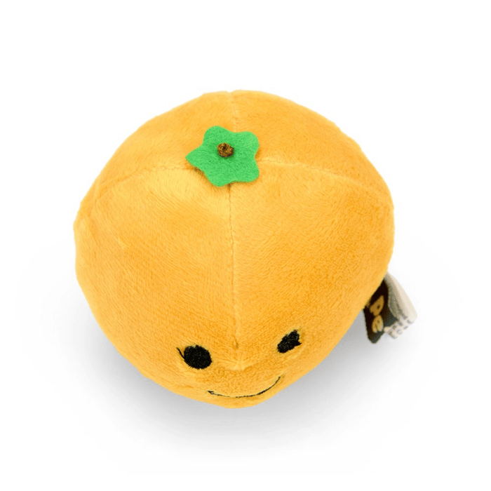 Top view of orange fruit plush toy with green leaf detail and a smiley face.