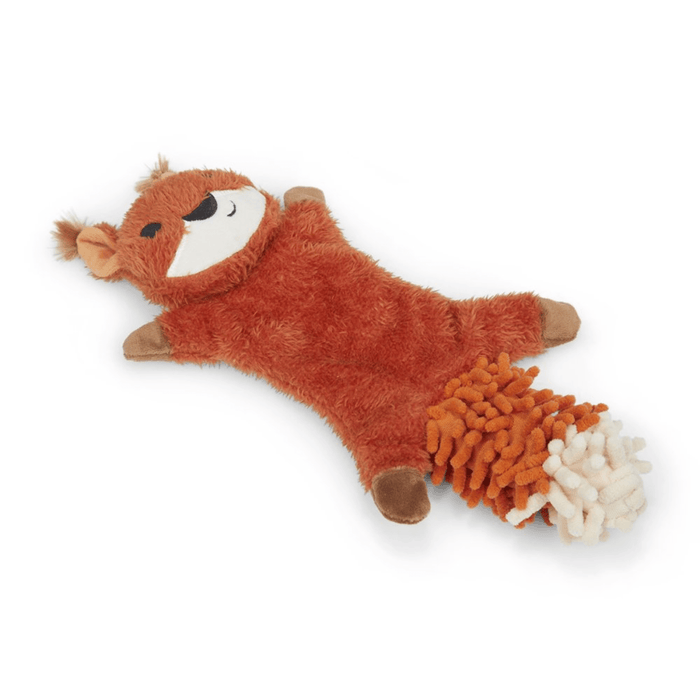 Side view of squirrel dog toy with orange fur and a white chin, tail made out of orange microfibre with a white tip lay on a white background.