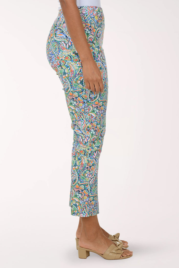 Colorful patterned pants worn by a person on a white background