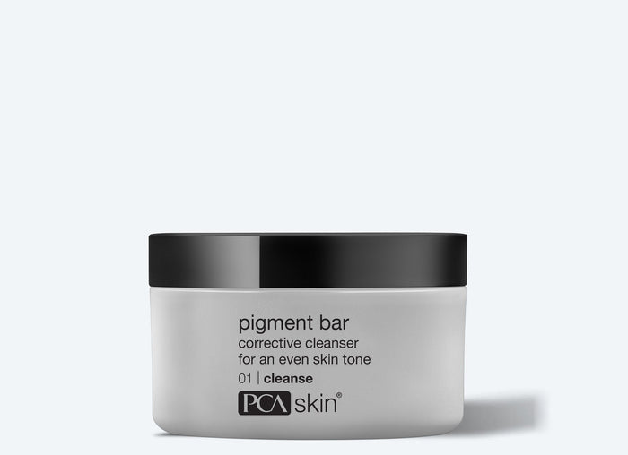 Pigment Bar | PCA Skin corrective cleanser in a sleek white jar with a black lid, designed for achieving an even skin tone in skincare routines.