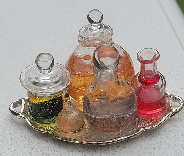 Potions and Frog in Glass Jar on Metal Platter