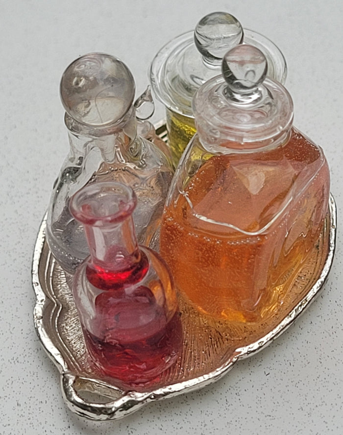 Potions and Frog in Glass Jar on Metal Platter