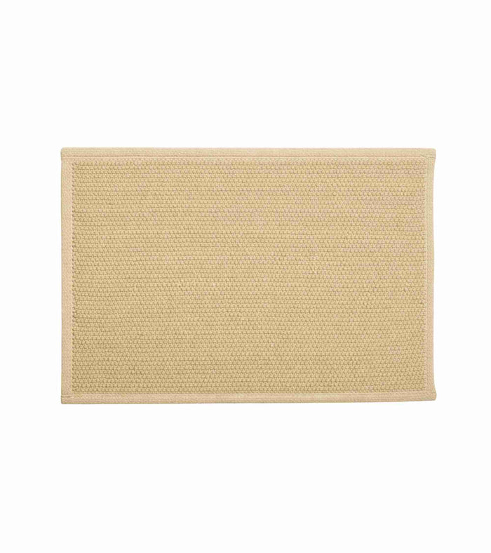Beige anti-skid bath mat, woven texture with stitched border; 60 x 40 cm