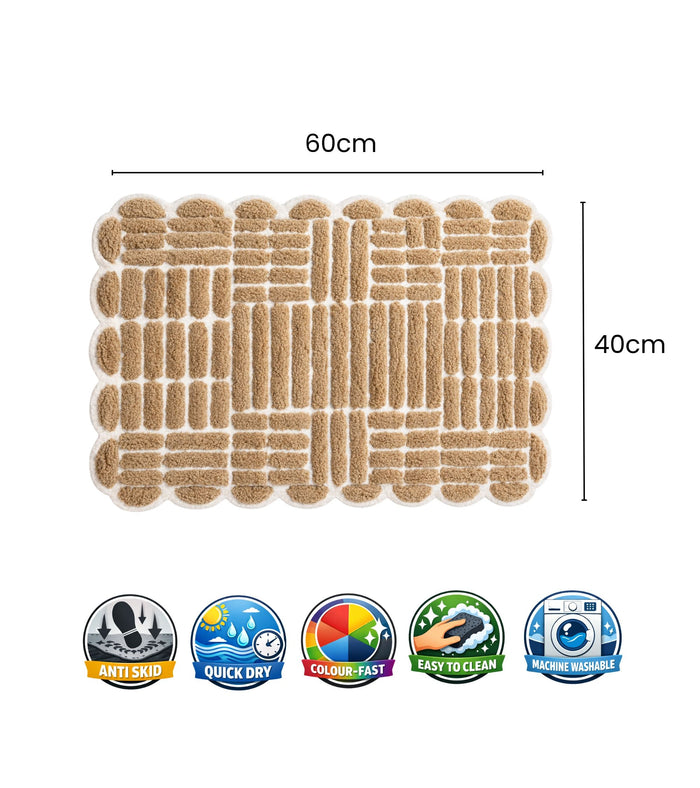 Beige bath mat with loop grid pattern and scalloped edges, 60 cm by 40 cm.