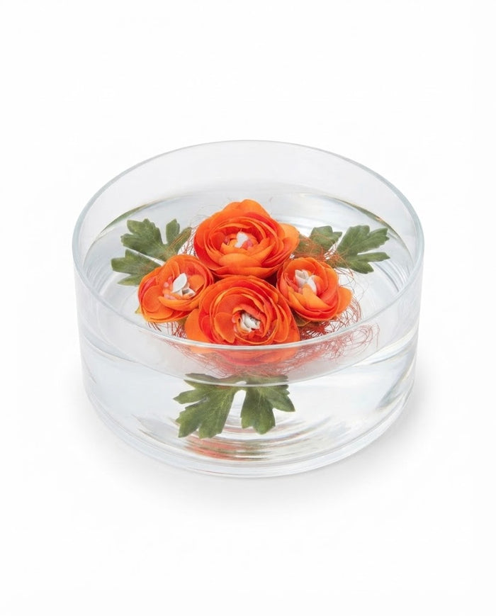 Premsons decorative floating orange ranunculus flowers with green leaves in clear dish