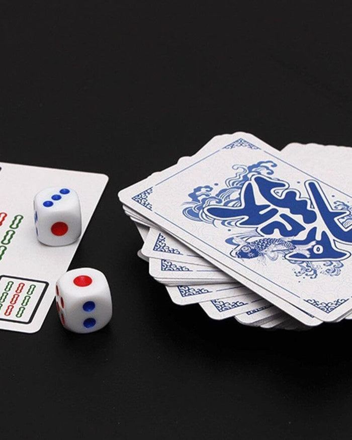 Mahjong playing cards with two dice showing red and blue dots