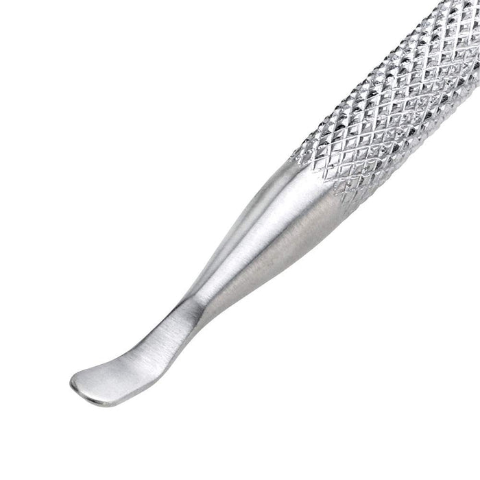 Close-up of a textured metal Pushy & Nail Cleaner | Tweezerman tool designed for precise nail care and cuticle maintenance.