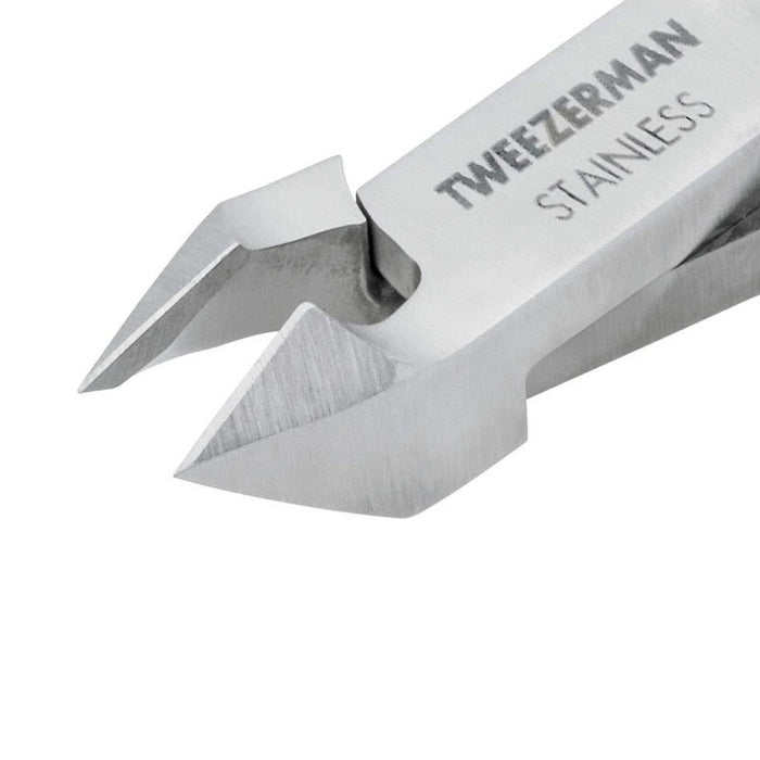 Close-up view of stainless steel Rockhard Cuticle Nipper | Tweezerman with sharp, precise curved blades designed for skincare and body care nail grooming.
