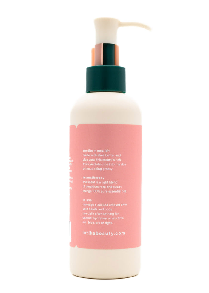 Back view of a skincare bottle with a pump dispenser showing usage instructions and ingredients for Rose (wildflower) Hand + Body Cream | Latika featuring shea butter, aloe vera, and essential oils for soothing and nourishing the skin.