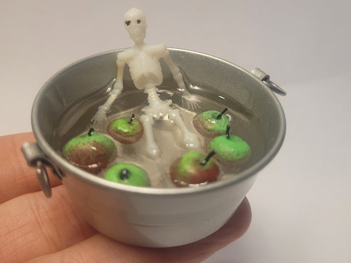 Skeleton Bobbing for Apples in Galvanized Tub