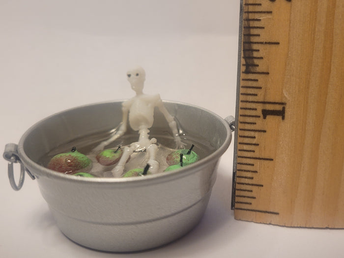 Skeleton Bobbing for Apples in Galvanized Tub