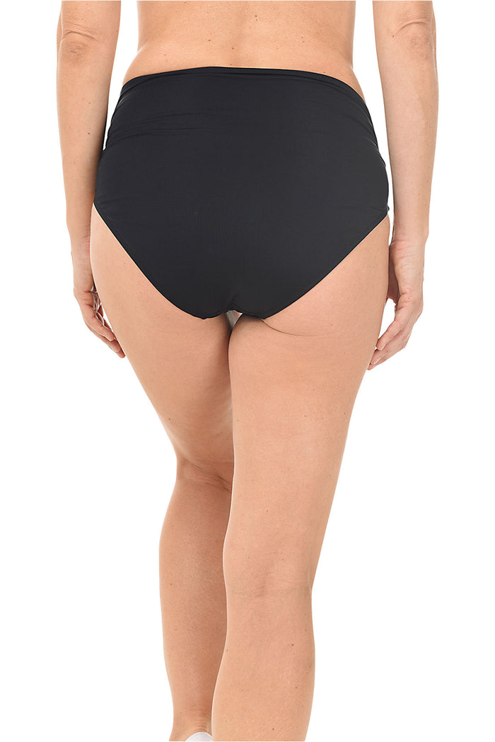 Person wearing a black high-waisted bikini bottom on a white background. Back shot.