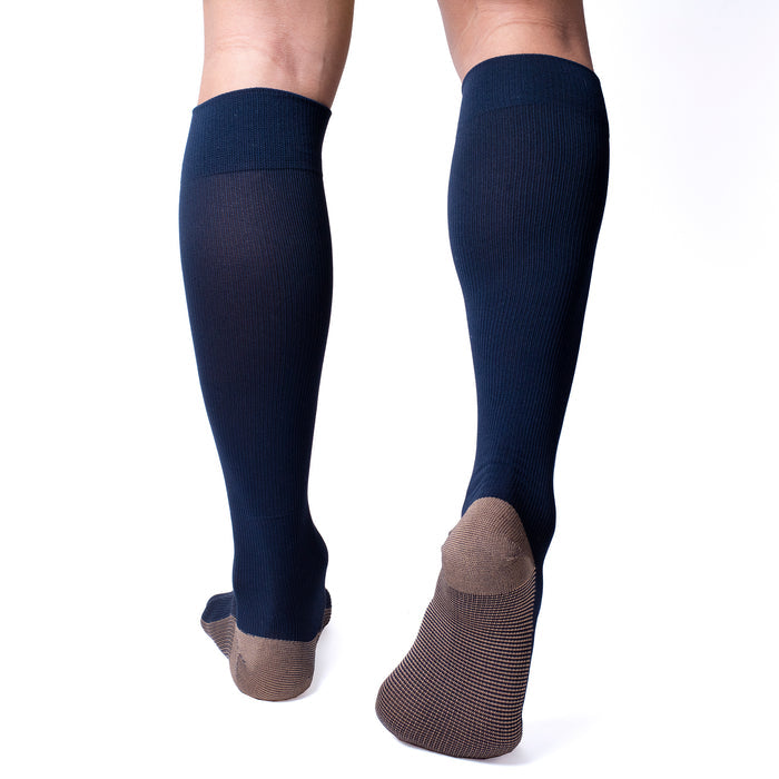Navy knee-high compression socks with a solid design and a contrasting brown toe and heel.