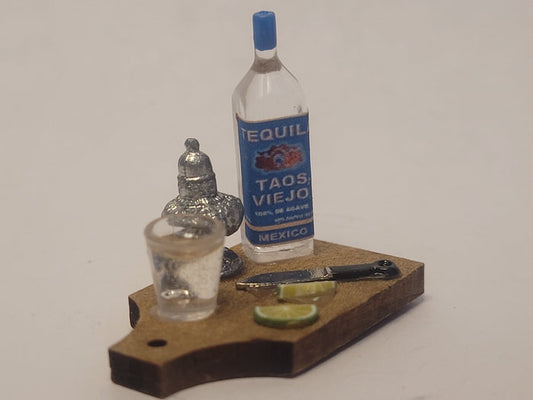 Tequila Shot with Lime on Wooden Board