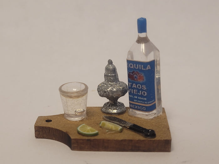 Tequila Shot with Lime on Wooden Board