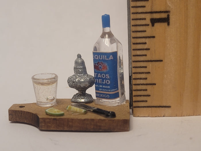 Tequila Shot with Lime on Wooden Board