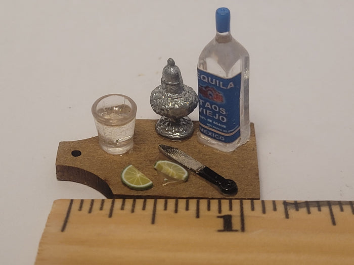 Tequila Shot with Lime on Wooden Board
