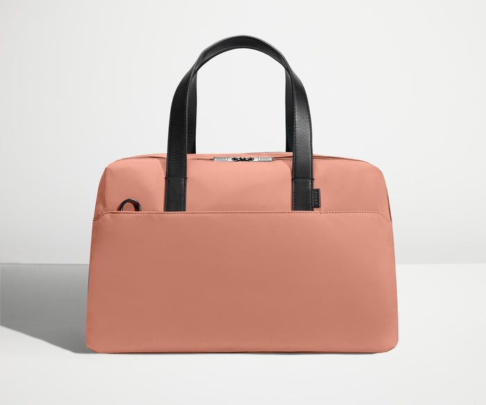 Front view of The Overnight Bag with leather straps up