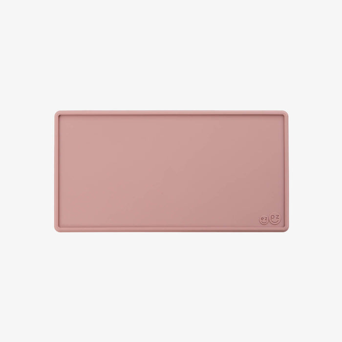 The Tiny Placemat in Blush is a non-slip, silicone placemat that fits on most highchair trays #color_blush