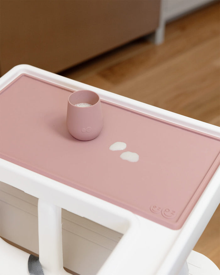 The Tiny Placemat in Blush is a non-slip, silicone placemat that fits on most highchair trays #color_blush
