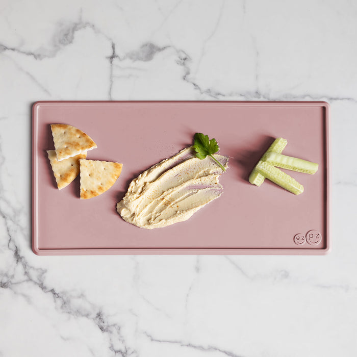 The Tiny Placemat in Blush is a non-slip, silicone placemat that fits on most highchair trays #color_blush