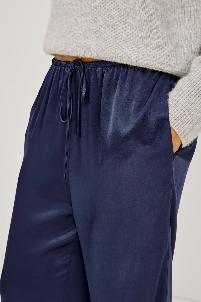 Virgo Pant in Satin-Back Crepe With Srtaight Legs, Drawstring Waist, and Side-Seam Pockets in Navy Colorway - Lower Body Close Up View Featured on Model