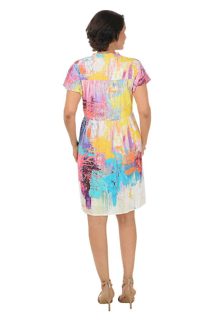 Woman wearing a colorful dress on a white background